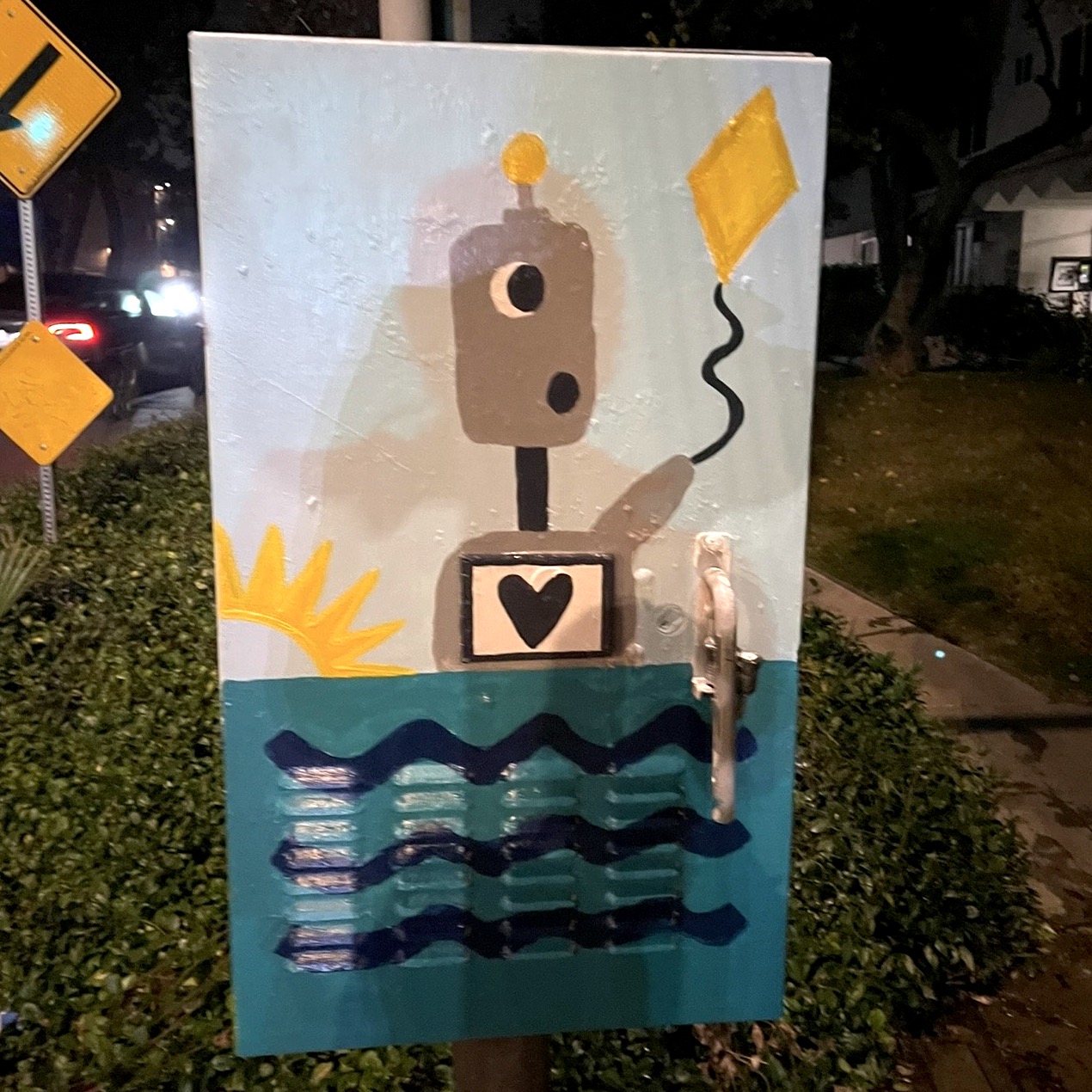 Robot floating in the ocean flying a yellow kite