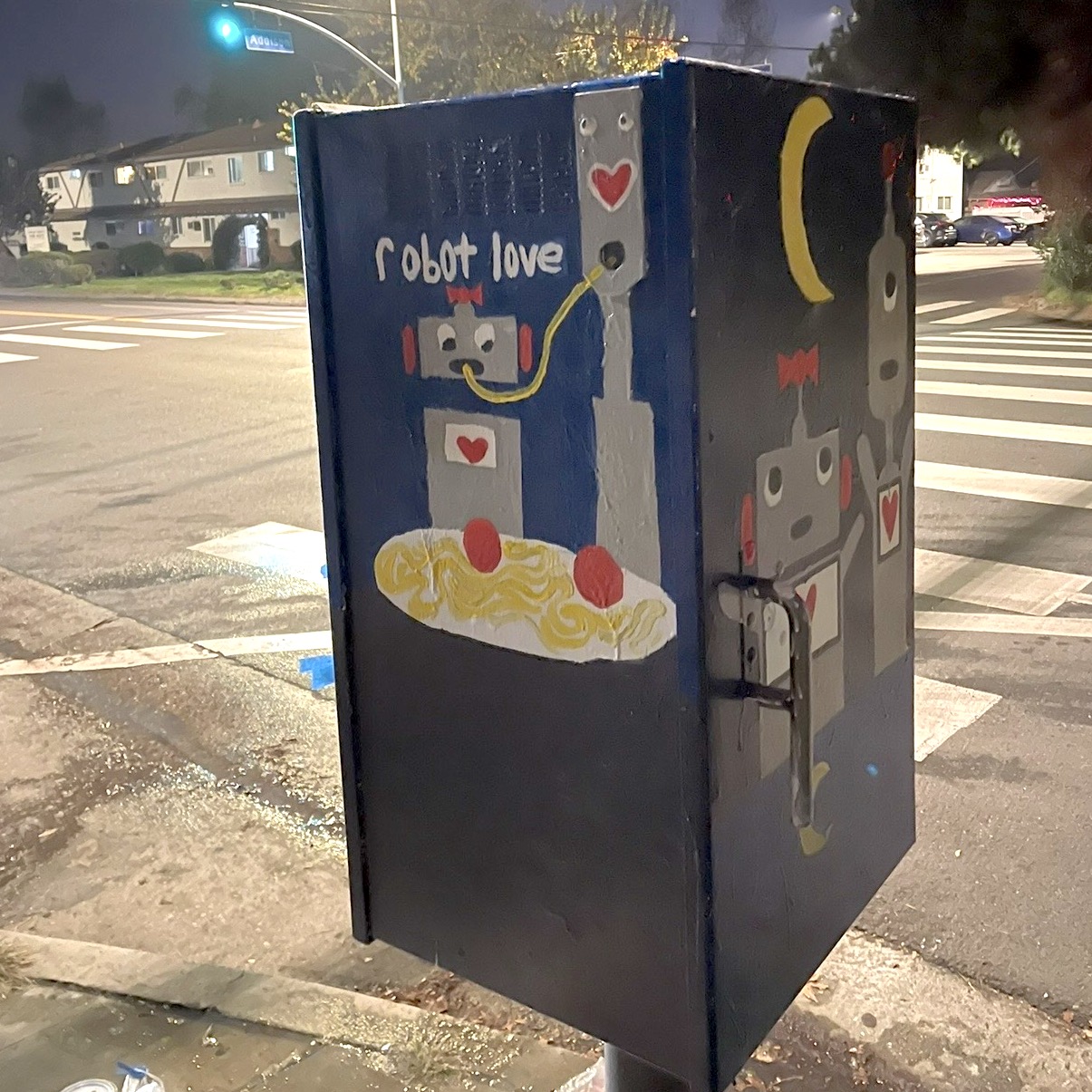 Close-up of Robot Love side panel showing robots sharing spaghetti