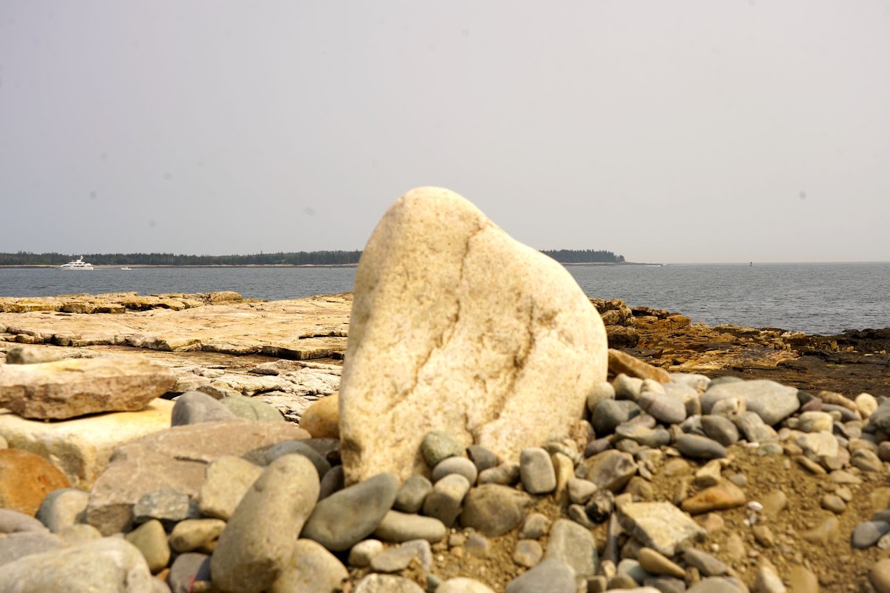 Granite erratic on cobble beach